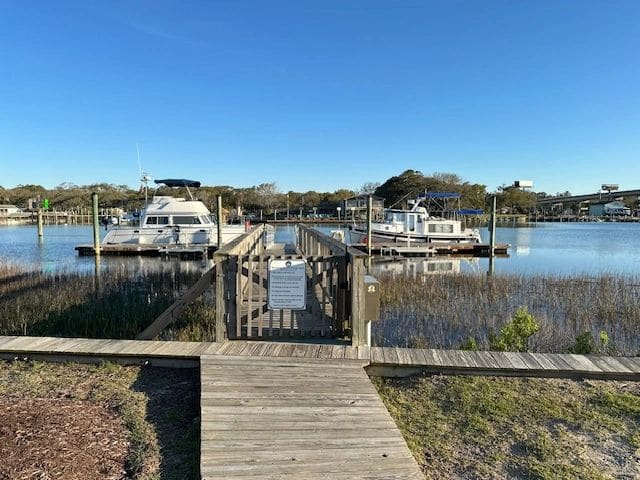 LT and a 35' catamaran at the 90' Holden Beach Town Dock.