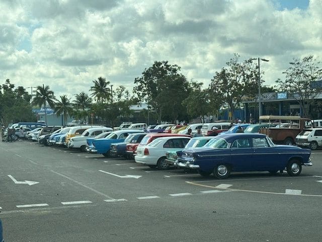 Airport parking lot (many of the older classic cars are used as taxis)
