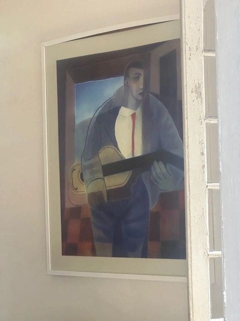 A Picasso over one of the beds.