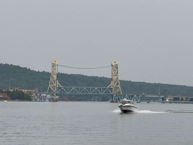 The Portage Lake Lift Bridge: Heaviest lift bridge in the world. It stays in intermediate position during the summer (35' clearance), and in the winter lowers so that snow mobiles (originally a train) can use the lower leve while cars cross on top.